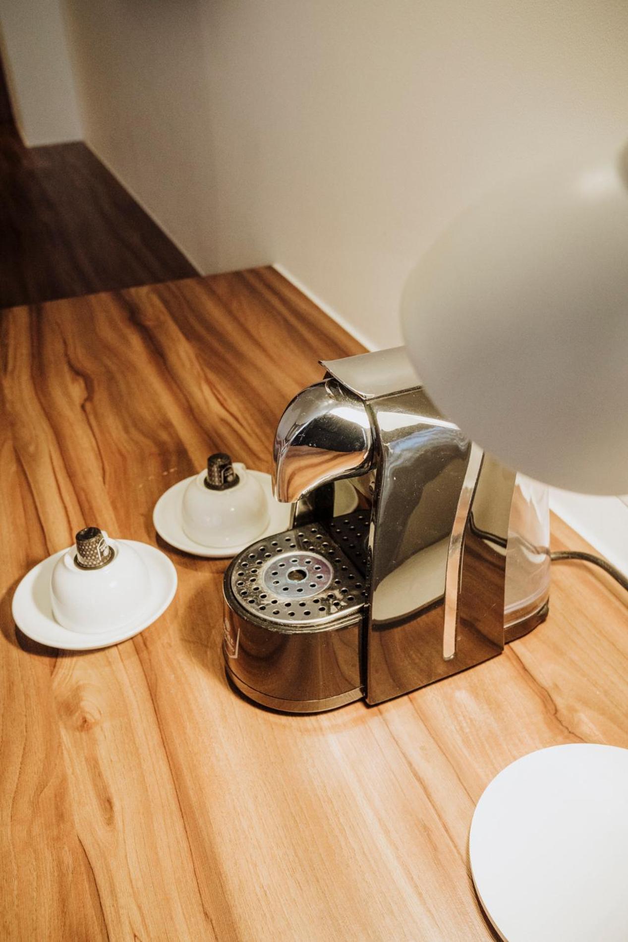 Novotel Medellin El Tesoro Luaran gambar A Nespresso coffee machine