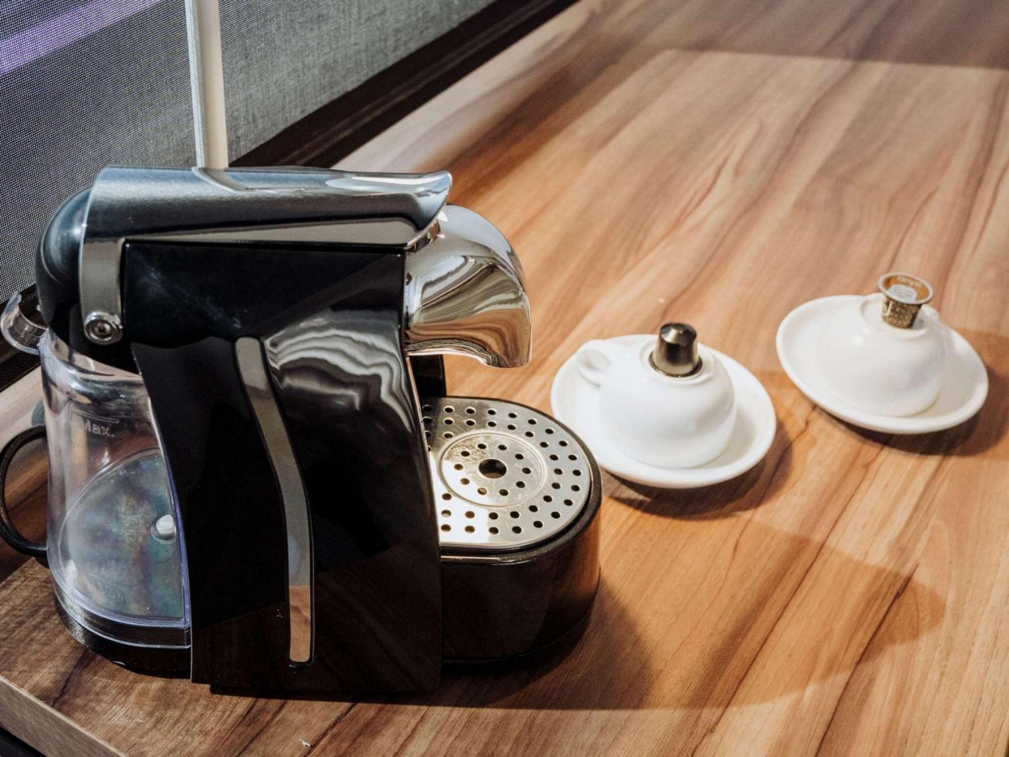 Novotel Medellin El Tesoro Luaran gambar A Nespresso coffee machine